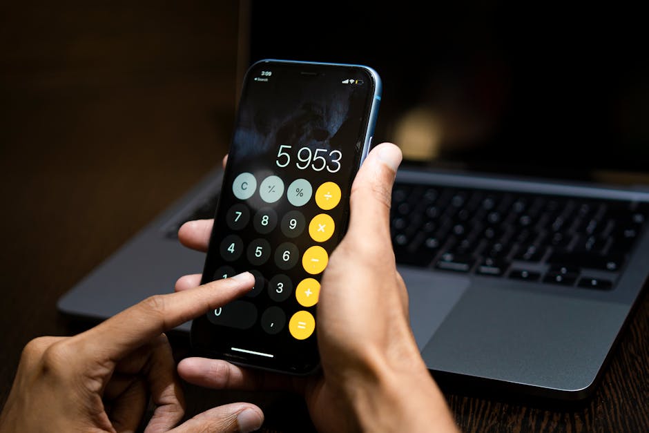person using a digital calculator on a smartphone to check move-in costs