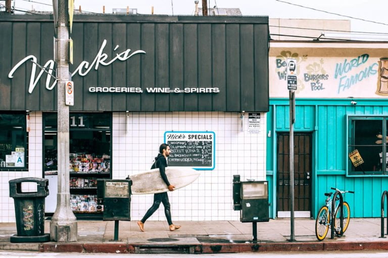 a person walking down a sidewalk
