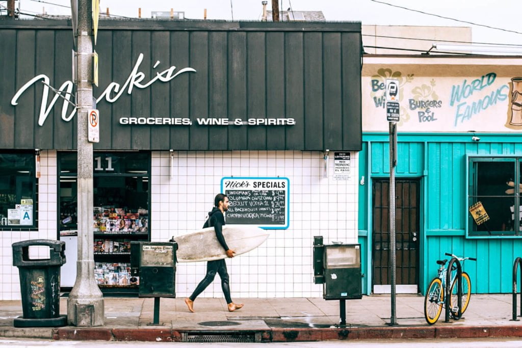 a person walking down a sidewalk