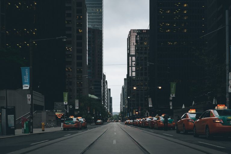 a city street with cars and buildings