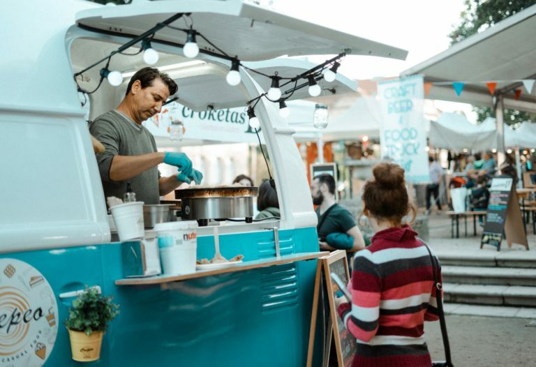 a person cooking food in a tent